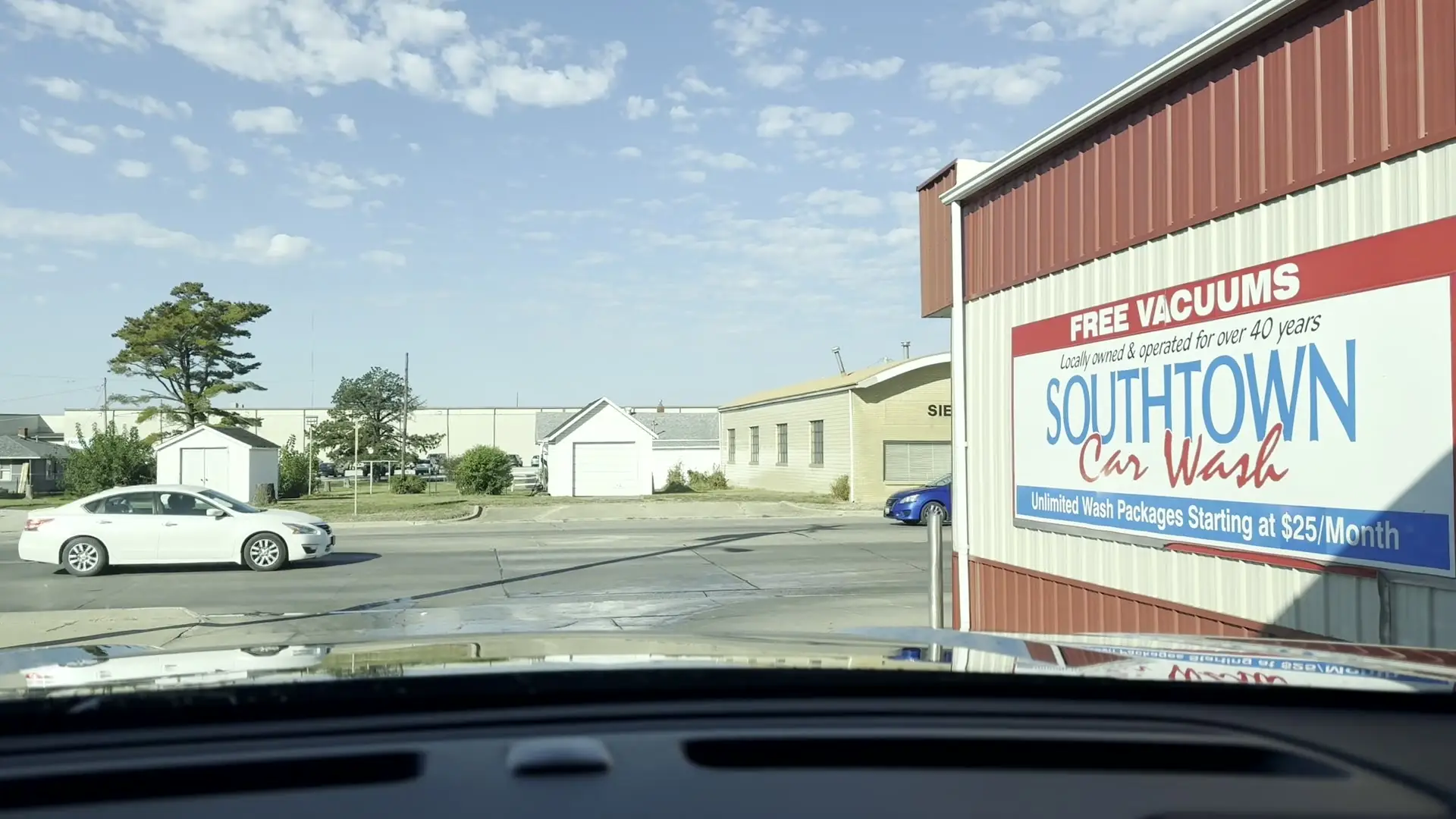 The Southtown Car Wash sign on the building, seen from the lot